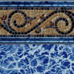 A pool liner design with a swirl pattern along the top and a water-looking design toward the bottom.