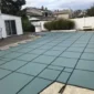 pool safety cover installation over inground pool