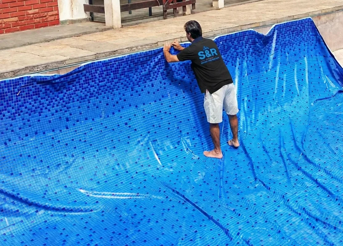 pool technician installing liner