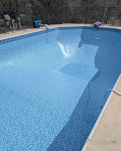 pool technician installing liner